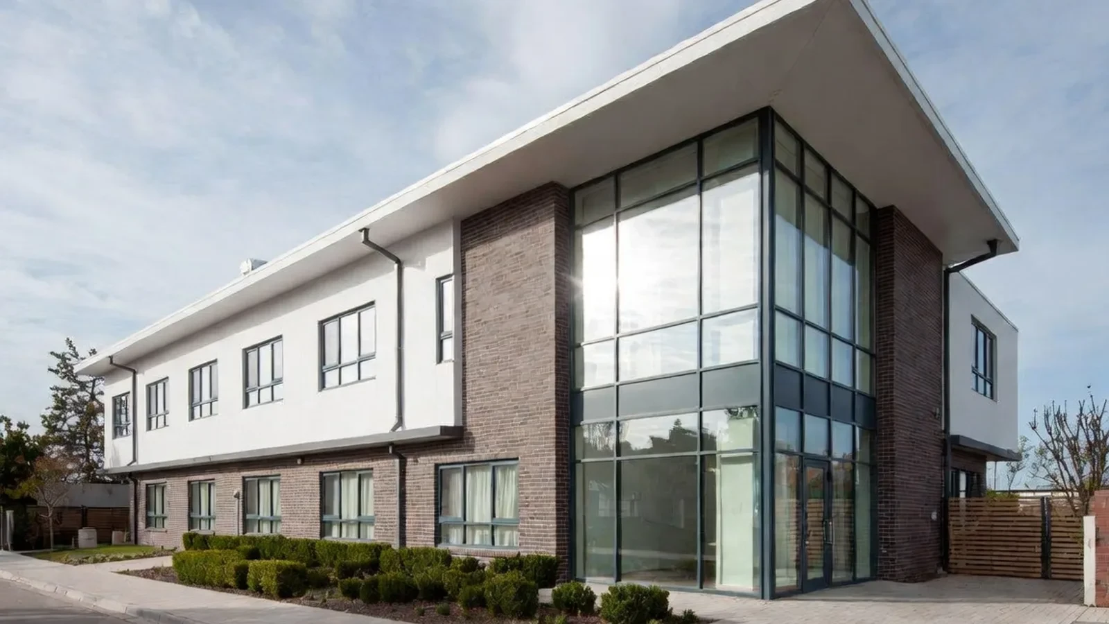 Modern office with brick and glass corner