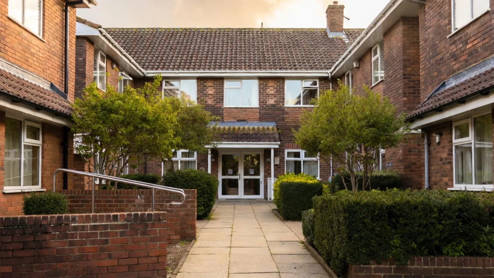 Brick residential courtyard with path and entrance