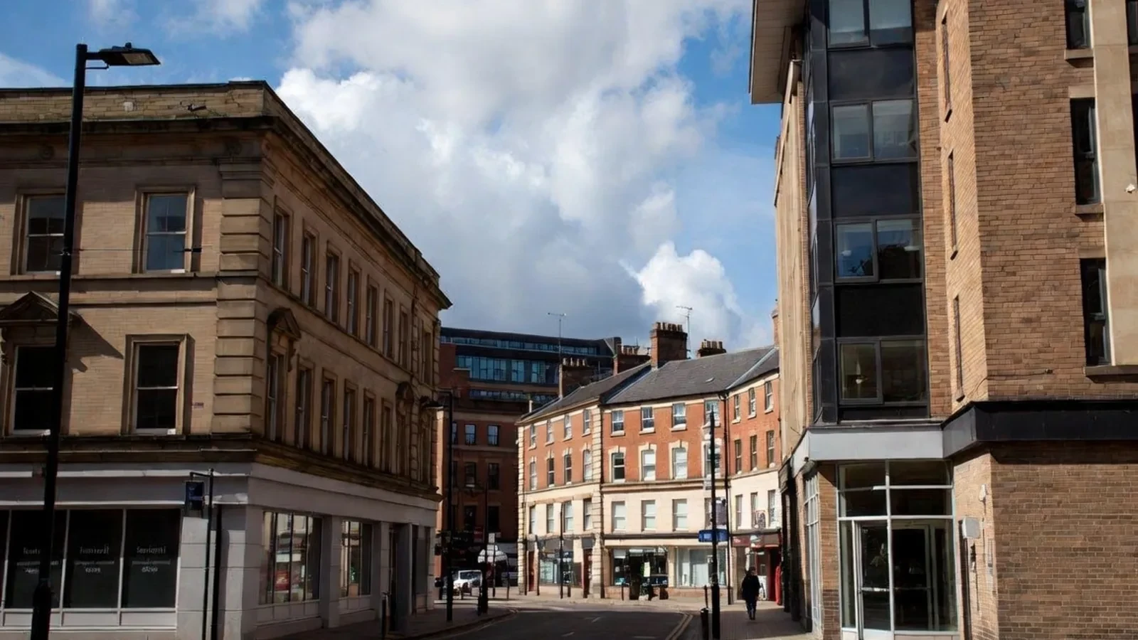 Commercial high street with retail premises and upper floors