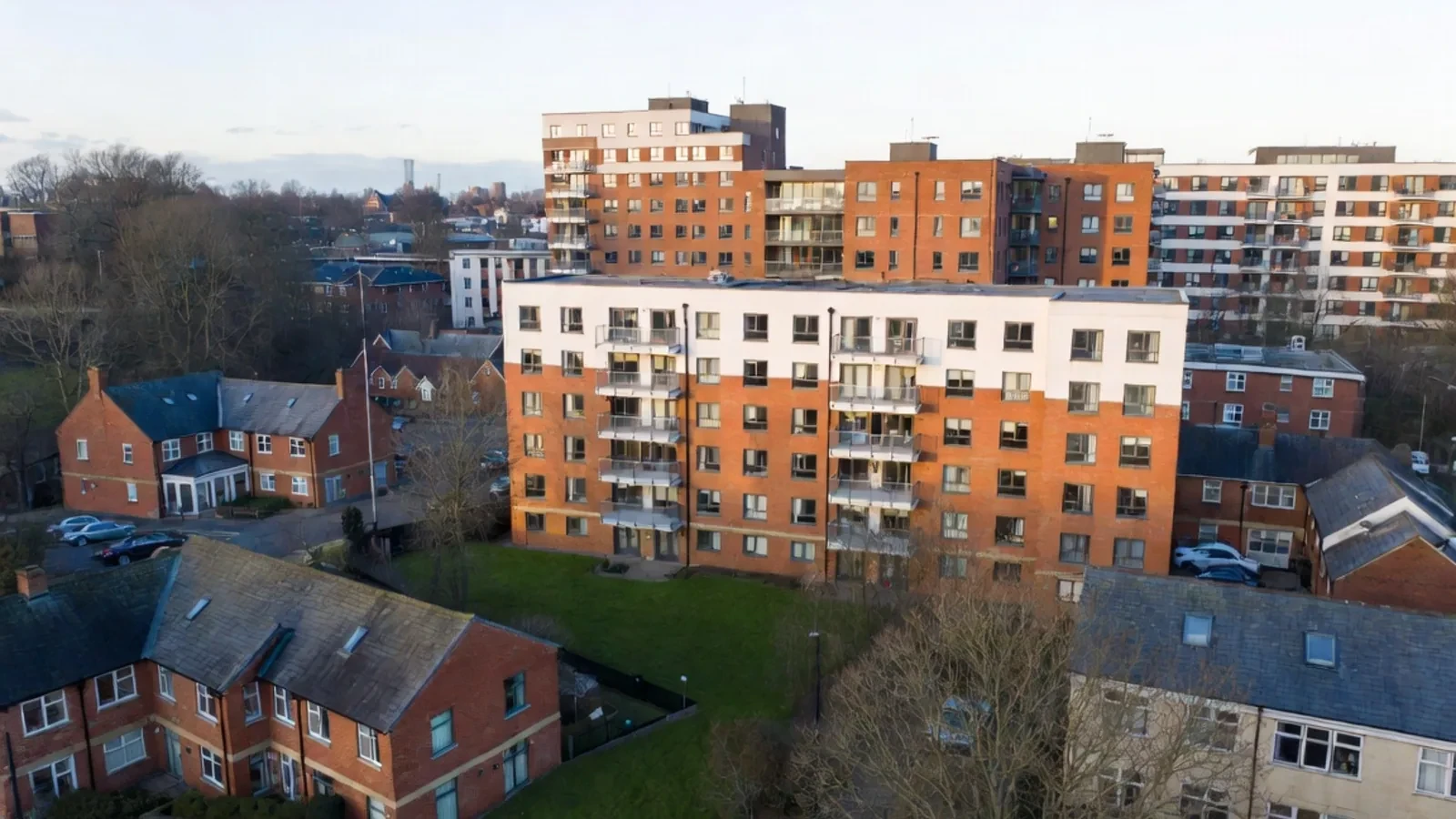 Apartment buildings and surrounding homes viewed across an East Midlands neighbourhood