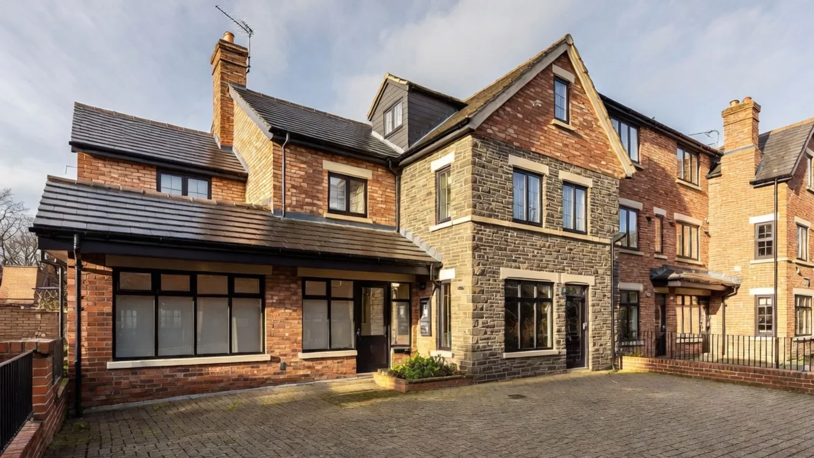 Large brick and stone house with courtyard