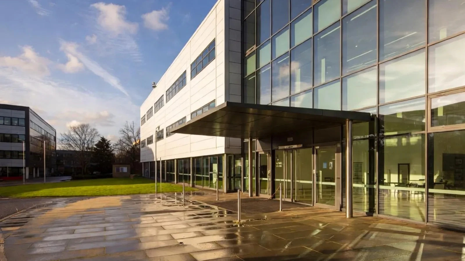 Modern glass office with dramatic entrance